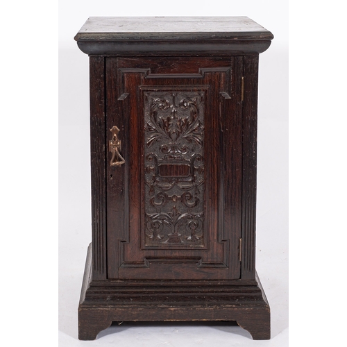 981 - A late Victorian/Edwardian dark oak pedestal cabinet, the interior fitted with three filing drawers,... 