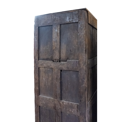 783 - A Jacobean carved oak linen cupboard, basically 17th century with adaptions; the relief carved friez... 