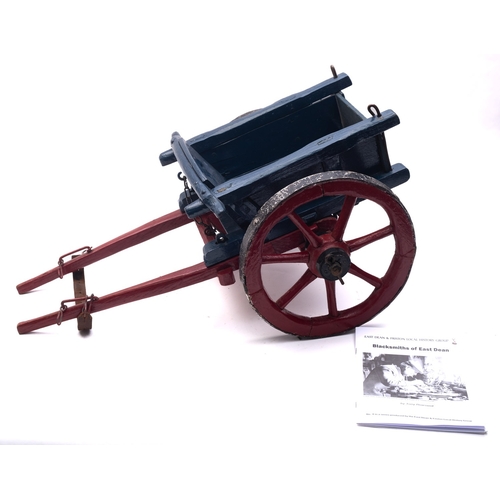 1289 - A  scratch built model of a Sussex cart by Luther Hills, blue body with red chassis and seven poked ... 