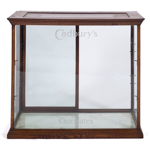 1290 - An early 20th century mahogany and glazed 'Cadbury's' shop counter display cabinet, the glazed front... 