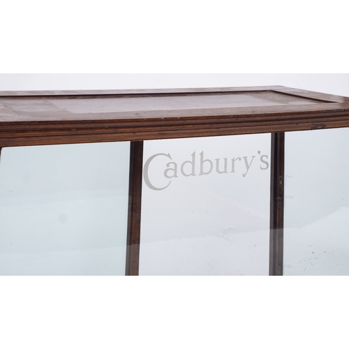 1290 - An early 20th century mahogany and glazed 'Cadbury's' shop counter display cabinet, the glazed front... 