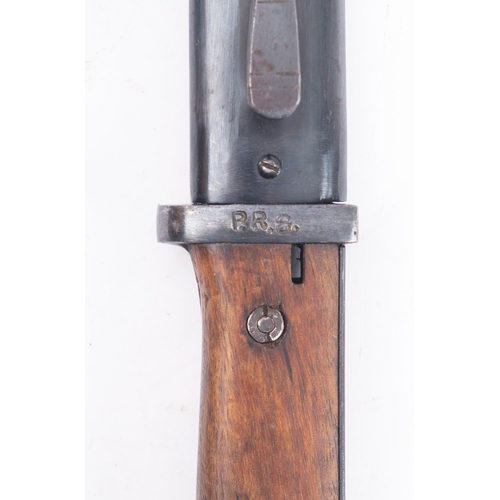 135 - A German Dress bayonet and Spanish 1943 Mauser bayonet, both with scabbards (2)