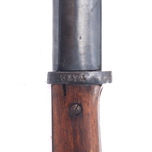 135 - A German Dress bayonet and Spanish 1943 Mauser bayonet, both with scabbards (2)