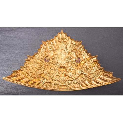 175 - A reproduction 17th Lancers gilt brass shako plate.