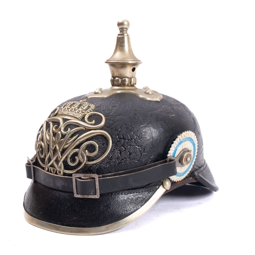 254 - A Prussian/Berlin Police Pickelhaube, the rounded finial spire with cross plate on a black skull wit... 