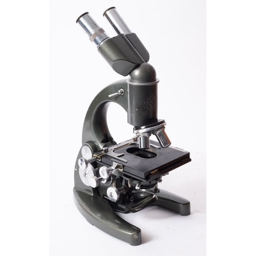 301 - A C. Baker, London. A binocular microscope serial number 1114,  together with seven lenses and acces... 