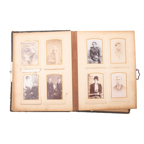 321 - A late 19th/early 20th century Carte de Vistie album, containing family portraits including one of a... 