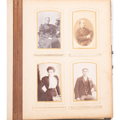 321 - A late 19th/early 20th century Carte de Vistie album, containing family portraits including one of a... 