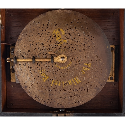 428 - A late 19th century walnut cased table Polyphon, with lithograph landscape to underside of lid,  tog... 