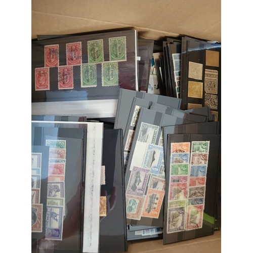 548 - World stamps in albums, on leaves, packets, stockcards, in 2 boxes.