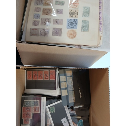 548 - World stamps in albums, on leaves, packets, stockcards, in 2 boxes.