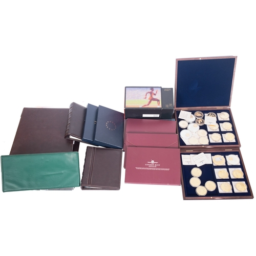 700 - A boxed set of Olympic 2012 50p pieces with Royal mail covers, European currency sets with two boxes... 