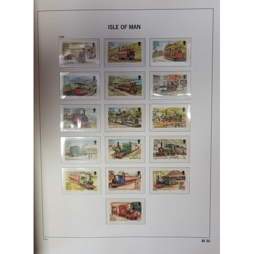 558 - A mint collection of Isle of Man stamps to 2013 in three hingless DAVO albums, also three similar al... 