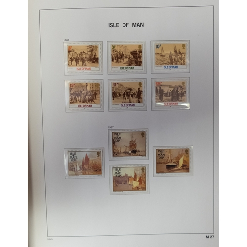 558 - A mint collection of Isle of Man stamps to 2013 in three hingless DAVO albums, also three similar al... 