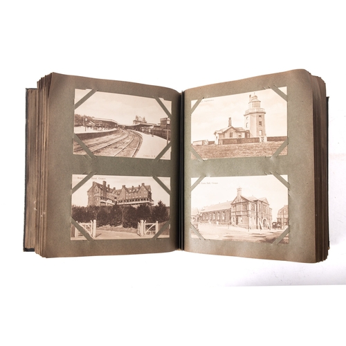 575A - An Edwardian postcard album of GB topographical views, the first two pages with three photograph of ... 