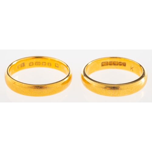 1046 - Two 22ct gold wedding bands, both UK hallmark, one size L1/2, one size K to K1/2, total gross weight... 