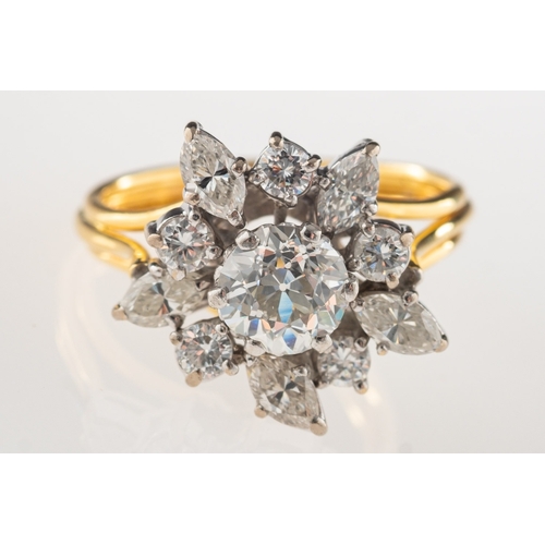 1053 - An 18ct gold diamond cluster ring, set to the centre with an old European-cut diamond, diamond appro... 