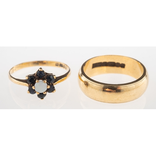 1075 - Two 9ct gold rings, including a 9ct gold wedding band, UK hallmark, size H1/2, 4.0grams; and a 9ct g... 