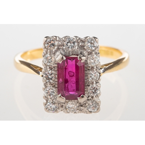 1108 - An 18ct gold ruby and diamond cluster ring, of rectangular form and claw set to the centre with a re... 