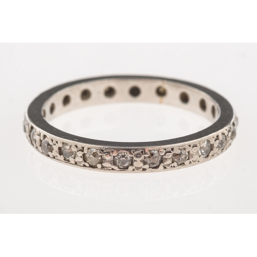 1113 - A full diamond eternity ring, a white metal ring set all the way around with brilliant-cut diamonds,... 