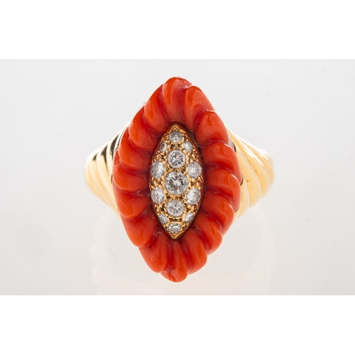 1117 - A 1970's 18ct gold coral and diamond cocktail ring, of navette form and set to the centre with brill... 