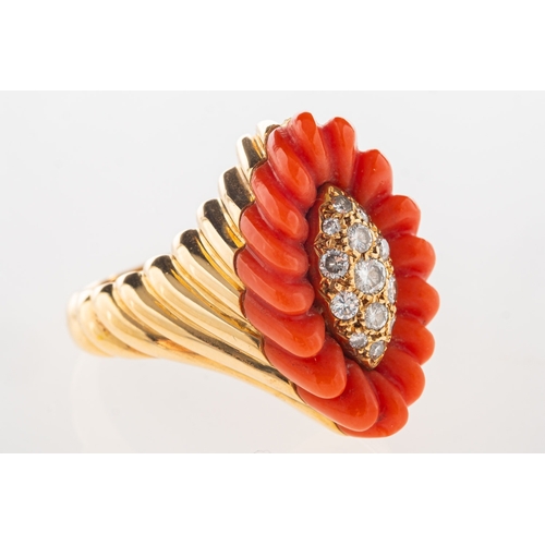 1117 - A 1970's 18ct gold coral and diamond cocktail ring, of navette form and set to the centre with brill... 