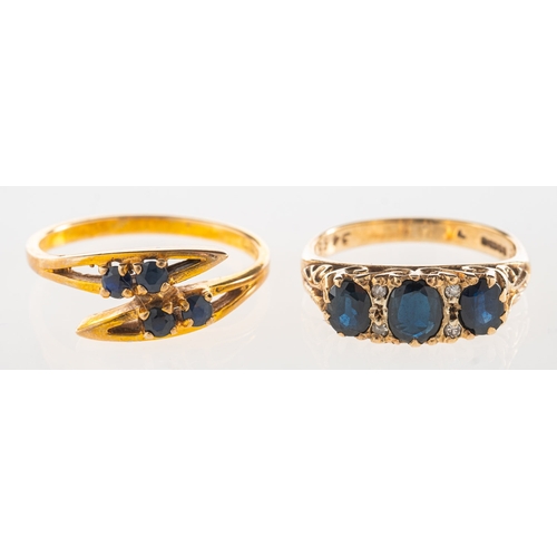 1119 - Two 9ct gold sapphire rings, including a scroll designed ring set with three oval-cut dark blue sapp... 