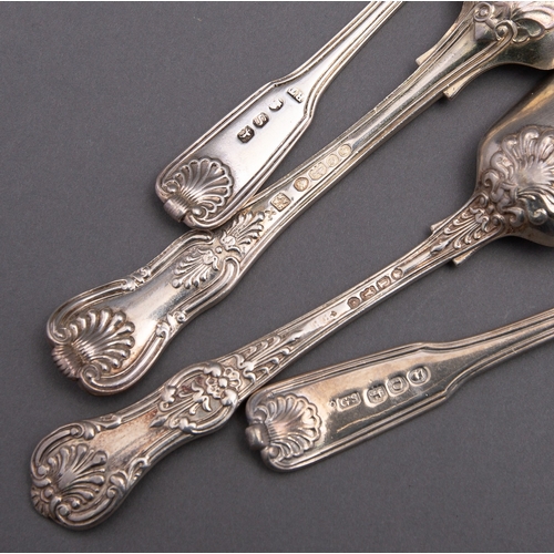 130 - A matched set of Victorian Kings and Queens pattern flatware including; three pairs of sugar tongs, ... 