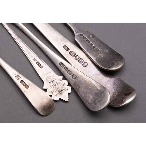 136 - A mixed group of silver flatware including; a George III silver Old English pattern gravy/ serving s... 