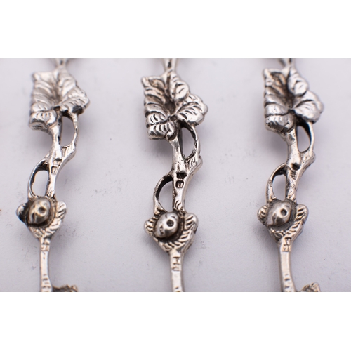 138 - A set of twelve early 20th century French silver cast pastry forks, 12cms. long, 147.7gms. (4.75ozs.... 