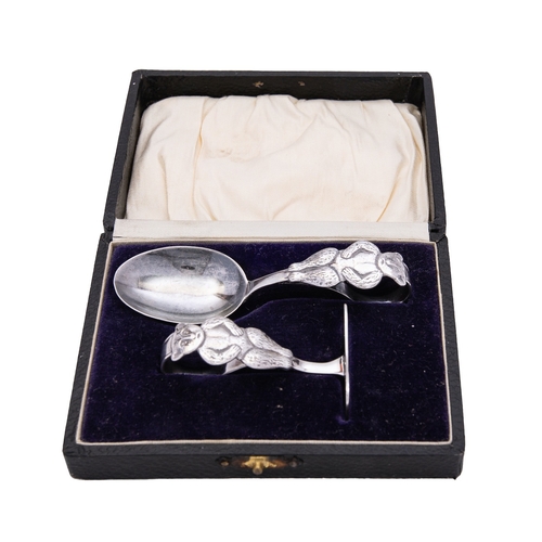 176 - A George V silver child's pusher and spoon by Crisford & Norris Ltd, Birmingham 1926, decorated with... 