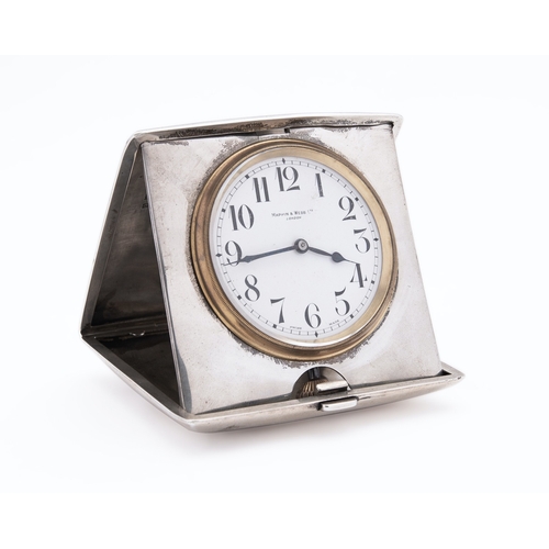 194 - A George V silver cased travel clock by Mappin & Webb, Birmingham 1913, of square form, the convex h... 