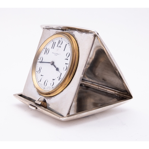 194 - A George V silver cased travel clock by Mappin & Webb, Birmingham 1913, of square form, the convex h... 