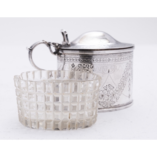 212 - A Victorian silver mustard pot by Richard Martin & Ebenezer Hall, London 1884, of oval form, the dom... 