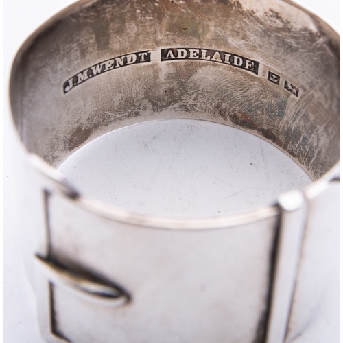 231 - A Victorian Australian silver napkin ring by J.M. Wendt, Adelaide, of strap form with engraved initi... 