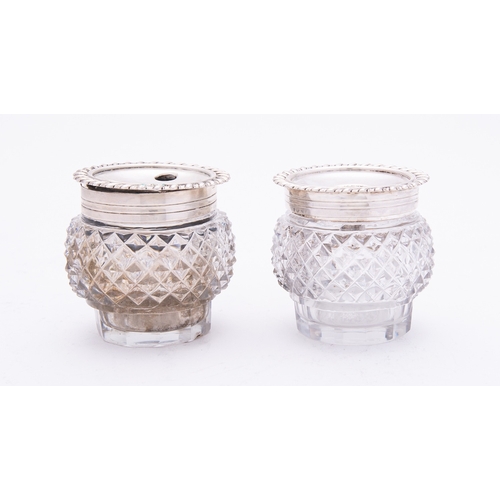 247 - A pair of Georgian silver and glass hobnail inkwells by W.E, London possibly 1786, of globular form,... 