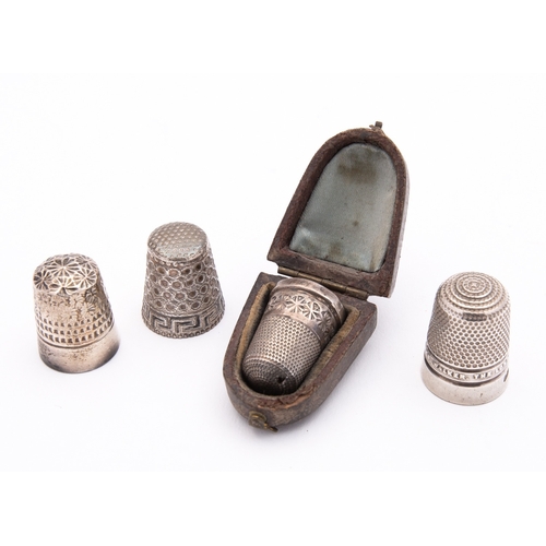 262 - A group of antique sewing accessories including; a Chester silver thimble by James Walker Ltd, Chest... 