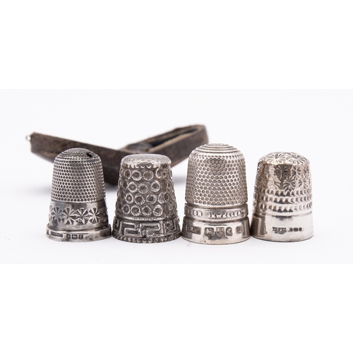 262 - A group of antique sewing accessories including; a Chester silver thimble by James Walker Ltd, Chest... 