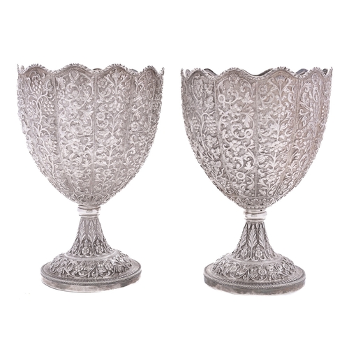 304 - A pair of late 19th century Indian Kutch silver standing cups or goblets marked W&O, probably Luckno... 