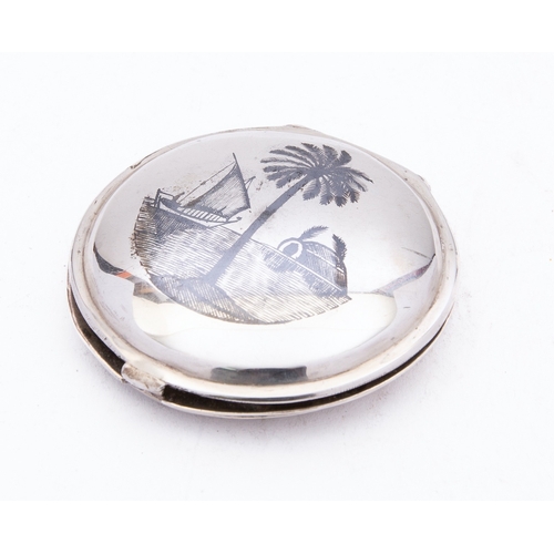 323 - A mid 20th century Iraqi silver compact with filigree cover, un-marked, niello decoration of dhows, ... 