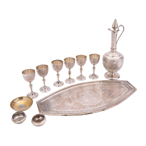 331 - A mid 20th century Iranian export silver liqueur set, unmarked, comprising  an oval tray, six liqueu... 