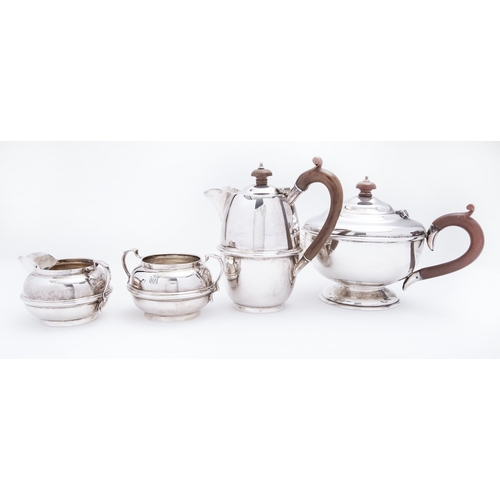 351 - A matched George V four piece silver tea service Charles Boyton & Son Ltd comprising; a hot water ju... 