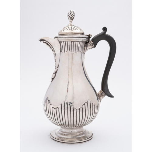 352 - A Victorian silver hotwater jug by Charles Stuart Harris, London 1875, of pear shape part reeded bod... 