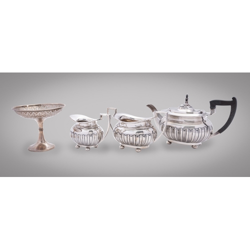 356 - An Edward VII silver three piece tea service by Walker and Hall, Sheffield 1903, comprising; a tea p... 