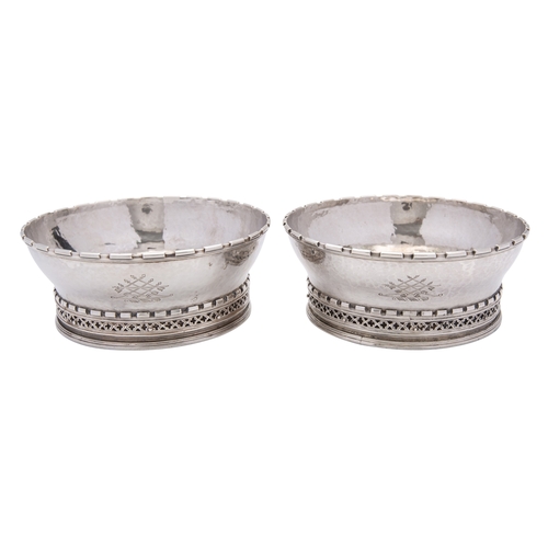 361 - A pair of Omar Ramsden silver wine coasters, London 1933, engraved Omar Ramsden Me Fecit, of circula... 