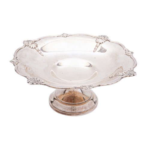 365 - An Elizabeth II silver tazza by Walker and Hall, Sheffield 1961, of shaped circular form, the wavy r... 