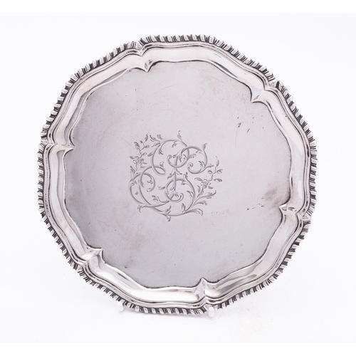 369 - A George III silver waiter by Ebenezer Coker, London 1764, of circular form, with gadrooned rim, pie... 