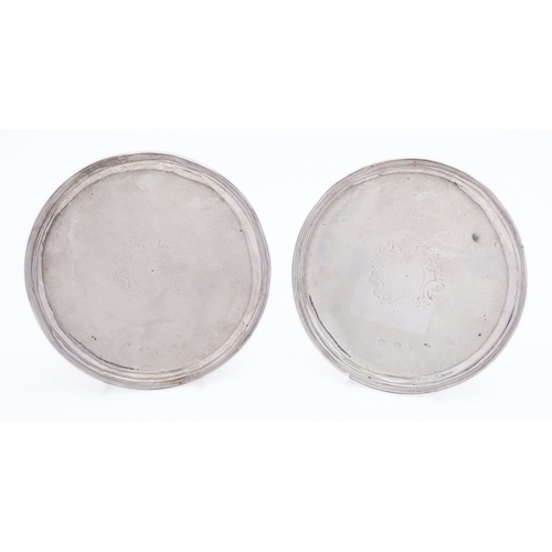 384 - A pair of 18th century silver patens marks almost rubbed out, probably London 1718?, of circular for... 