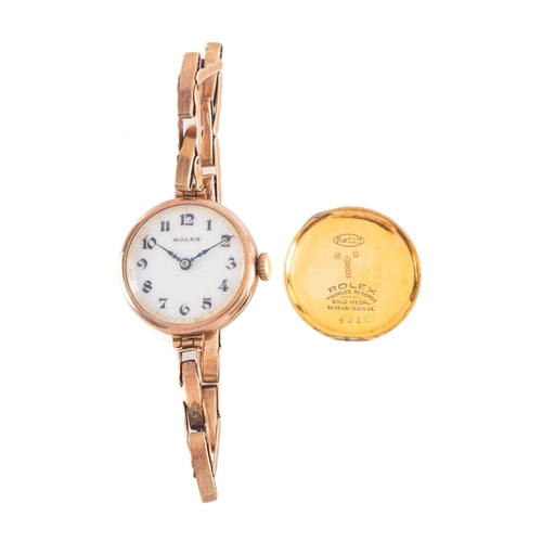 448 - Rolex, a vintage ladies gold wristwatch the round white dial having black Arabic numerals, blued ste... 