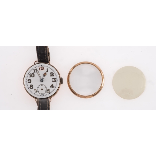 448A - A vintage 9ct gold lady's wristwatch the round white dial with gilt and red Arabic numerals, shaped ... 